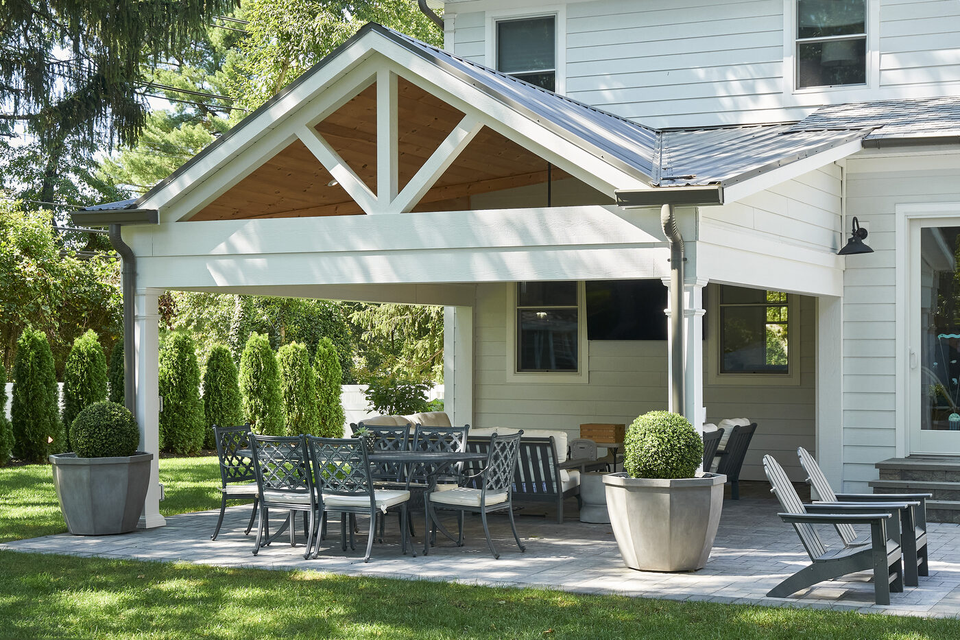 Custom Homestead attached pavilion in A-Frame configuration anchored to the home