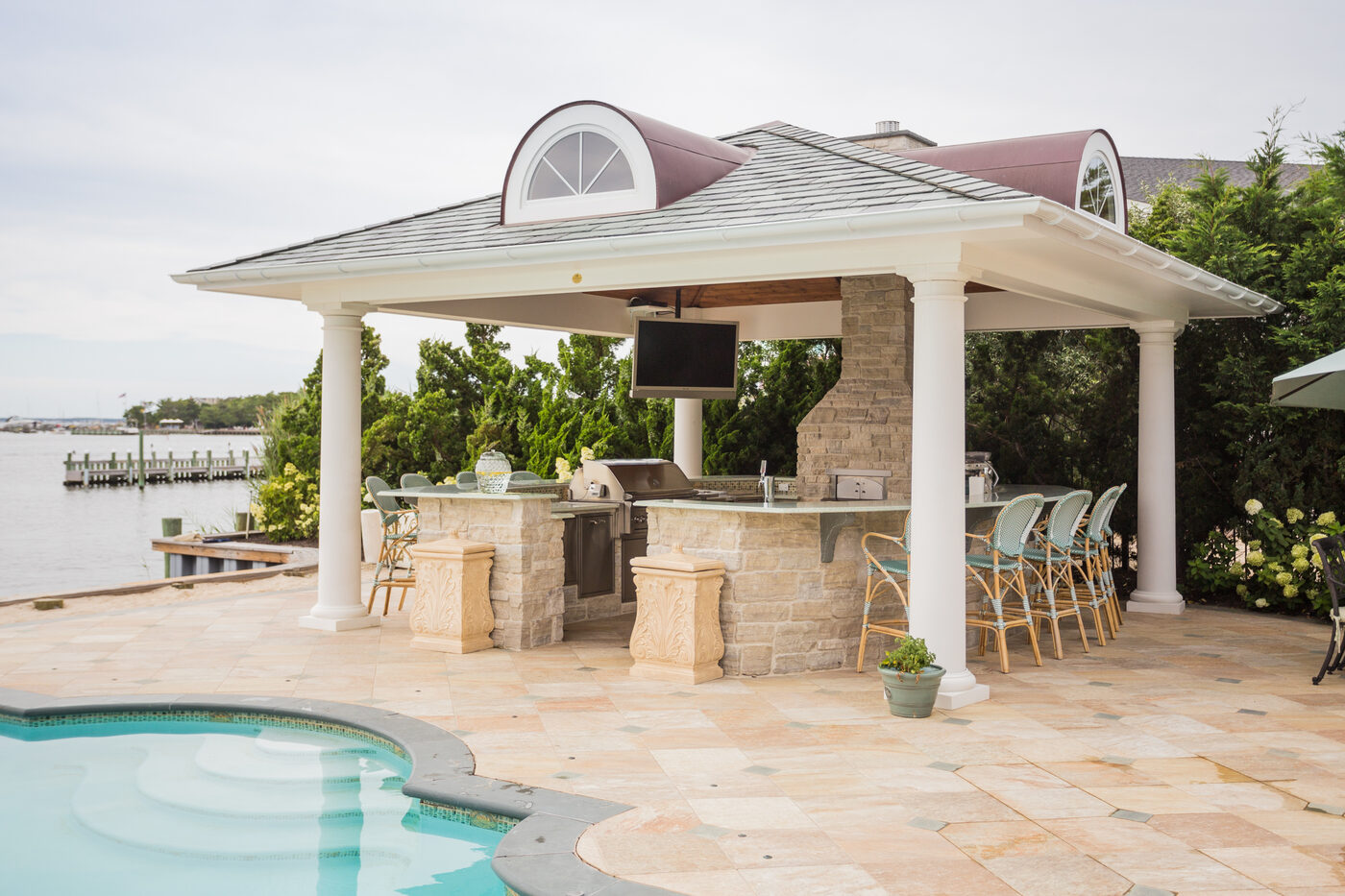Custom Homestead pavilion with cedar cathedral ceiling, cupola, and full outdoor kitchen with granite countertops