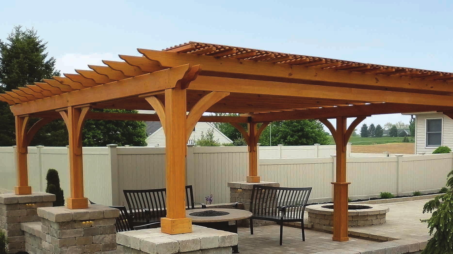 Homestead Structures Elegant Wood pergola in a backyard with cinder stain and lattice roof