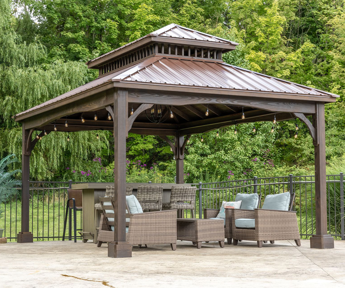 Berlin Gardens Hampton in mocha with classic metal roof in brown and arched braces